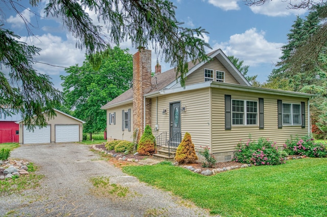 view of front of house with a front lawn, an outdoor structure, and a garage