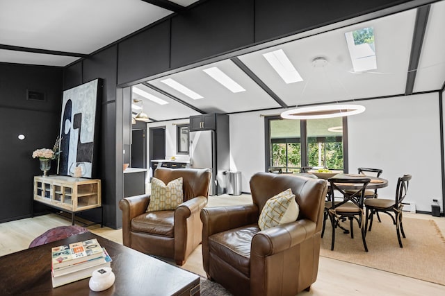 living room with light wood-type flooring and a baseboard heating unit