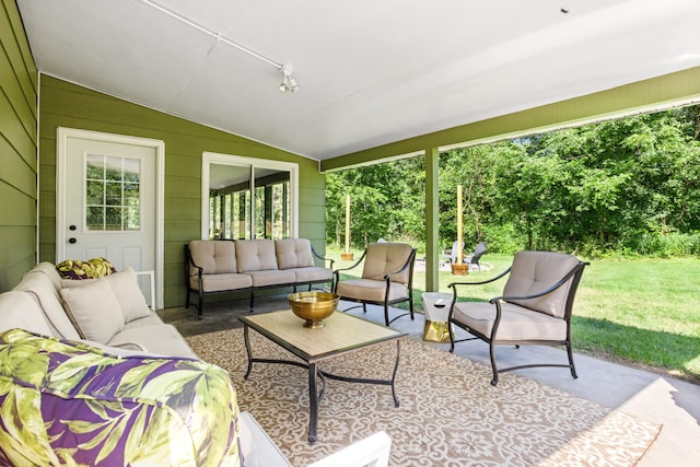 sunroom / solarium with lofted ceiling