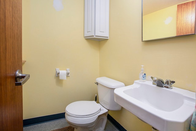 bathroom featuring toilet and sink