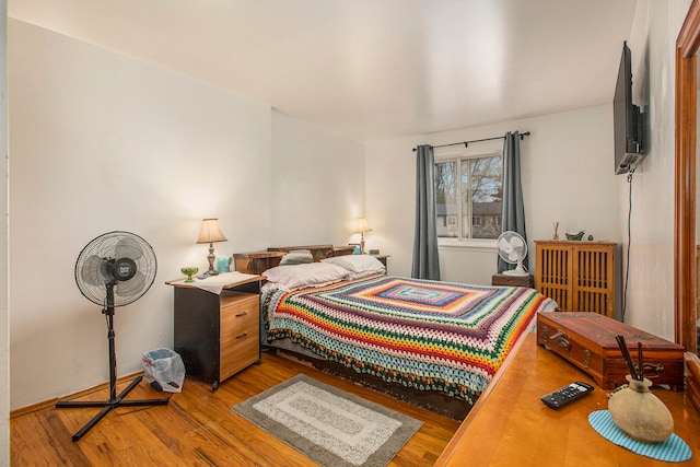 bedroom with wood-type flooring