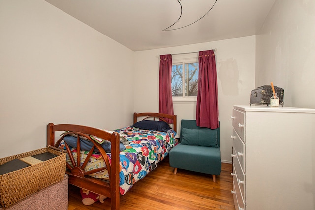 bedroom featuring hardwood / wood-style floors