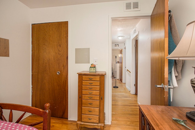 bedroom featuring light wood-type flooring and a closet