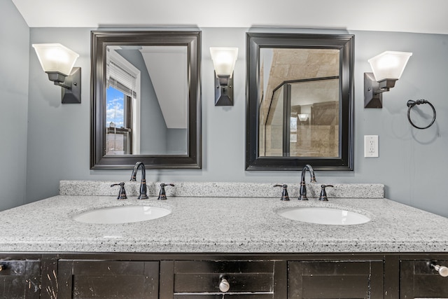 bathroom with vanity, lofted ceiling, and walk in shower