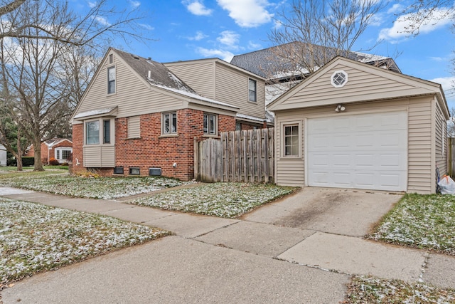 view of front of house with an outbuilding and a garage