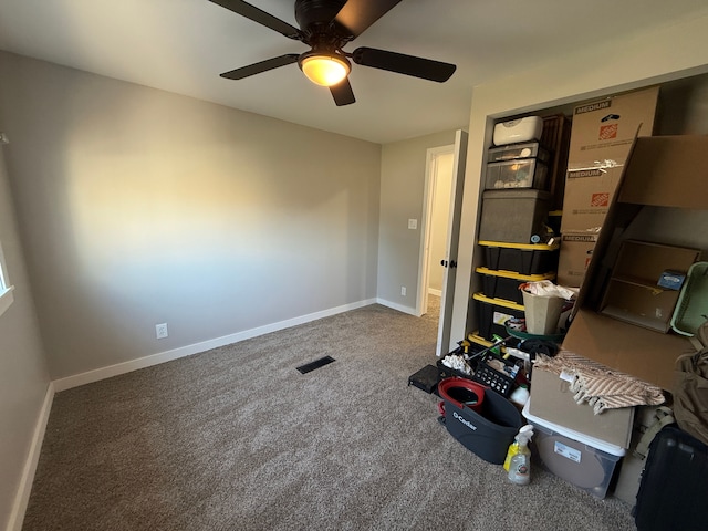 interior space featuring carpet flooring and ceiling fan