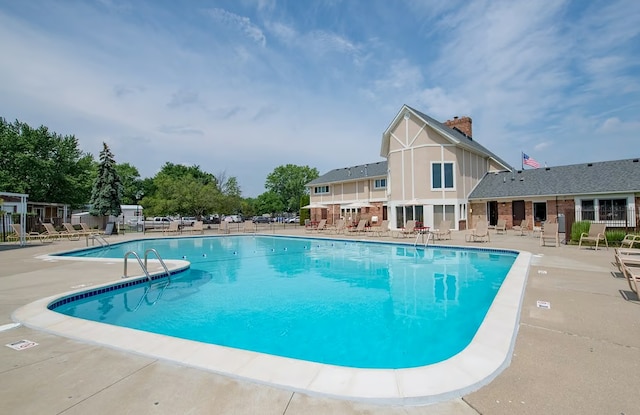 view of swimming pool with a patio