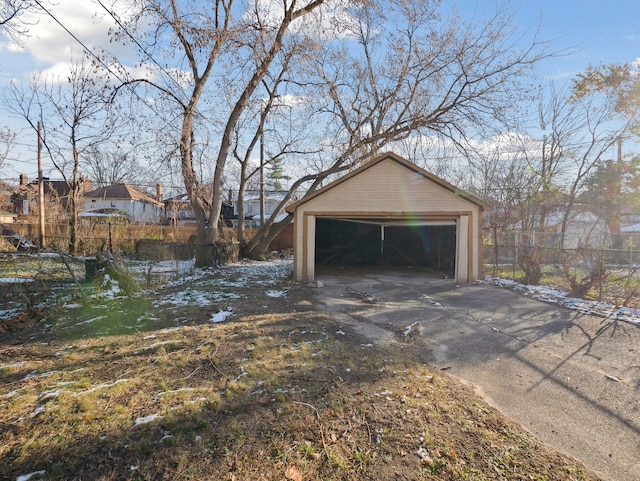 exterior space with a garage and an outdoor structure