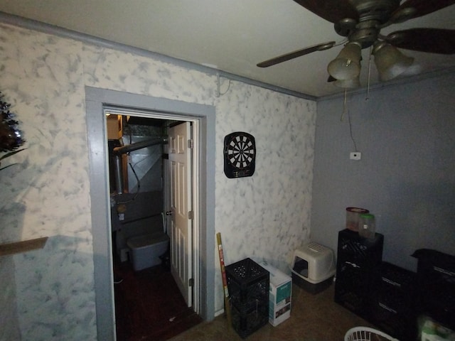 interior space with ceiling fan