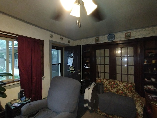 living area with ceiling fan