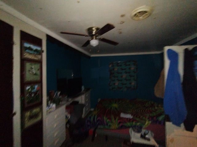 bedroom featuring ceiling fan and crown molding