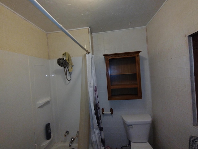 bathroom with shower / tub combo and toilet