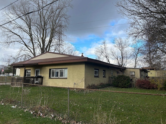 view of property exterior featuring a yard