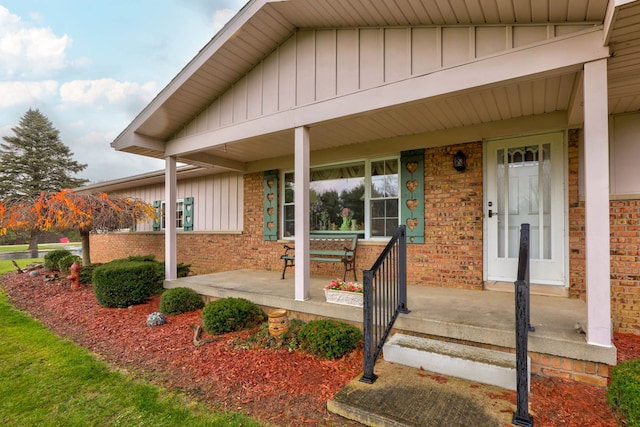 property entrance featuring covered porch