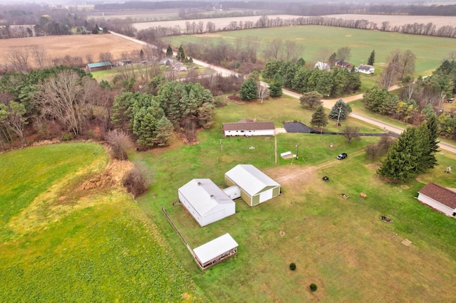 birds eye view of property featuring a rural view