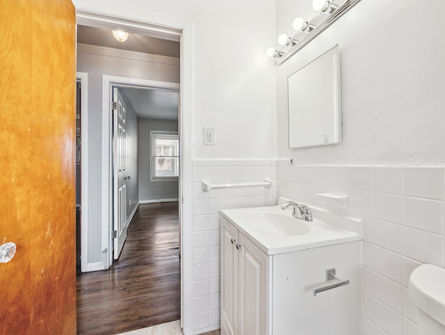 20019 Westbrook St, Detroit, MI 48219 - half bath with tile walls, vanity, wood finished floors, and wainscoting
