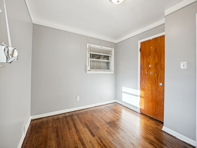 unfurnished room featuring hardwood / wood-style floors