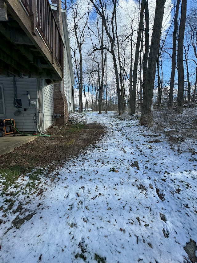 view of yard layered in snow