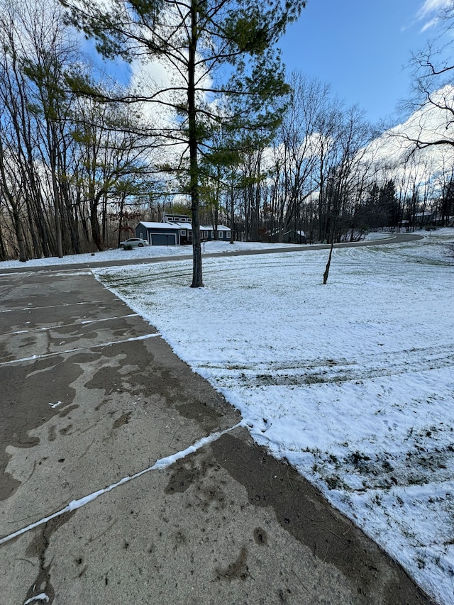 view of yard layered in snow