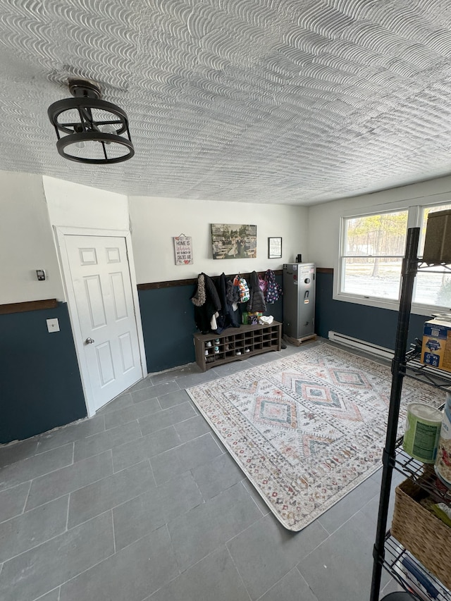 living room with dark tile patterned floors and a textured ceiling