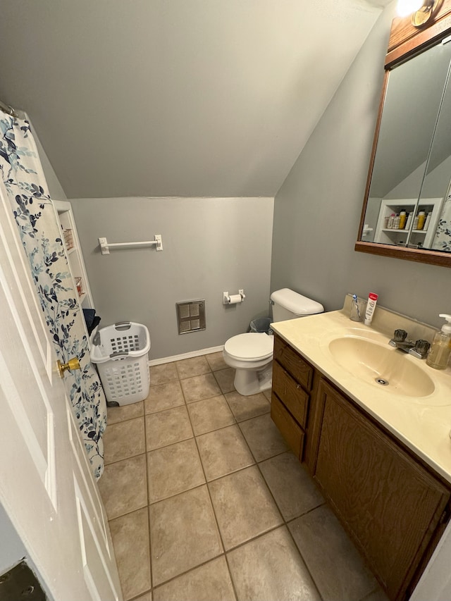 bathroom featuring tile patterned flooring, heating unit, vaulted ceiling, toilet, and vanity