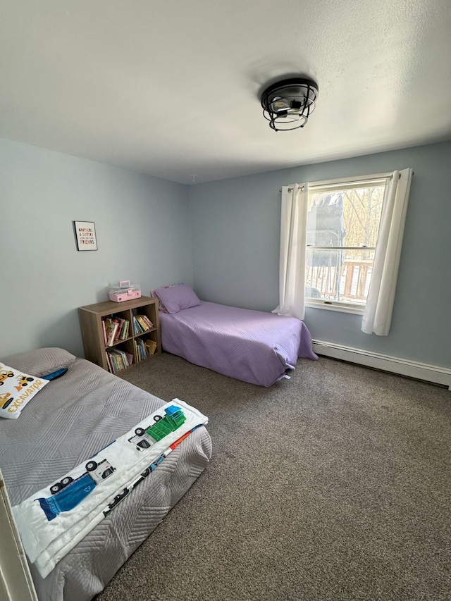 carpeted bedroom with baseboard heating