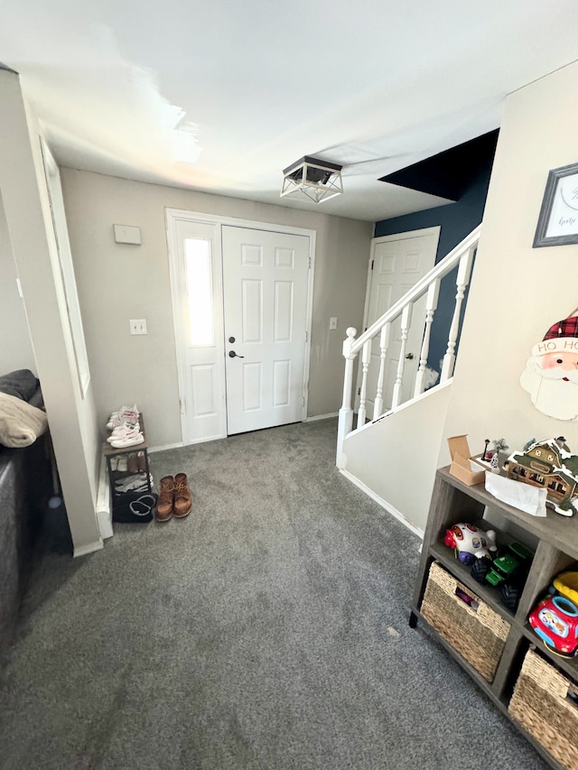 entryway featuring dark colored carpet