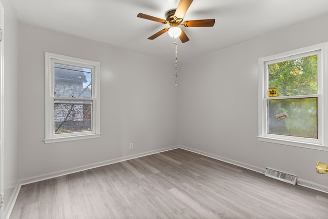 spare room with ceiling fan and hardwood / wood-style floors