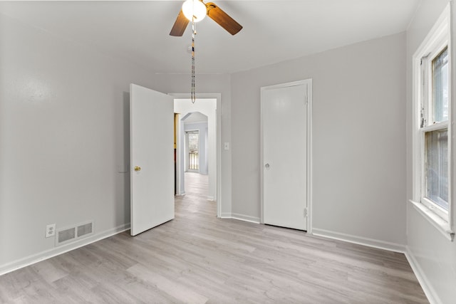 unfurnished dining area with plenty of natural light, light hardwood / wood-style floors, and ceiling fan