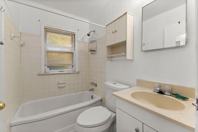 full bathroom with vanity, ornamental molding, tiled shower / bath combo, and toilet