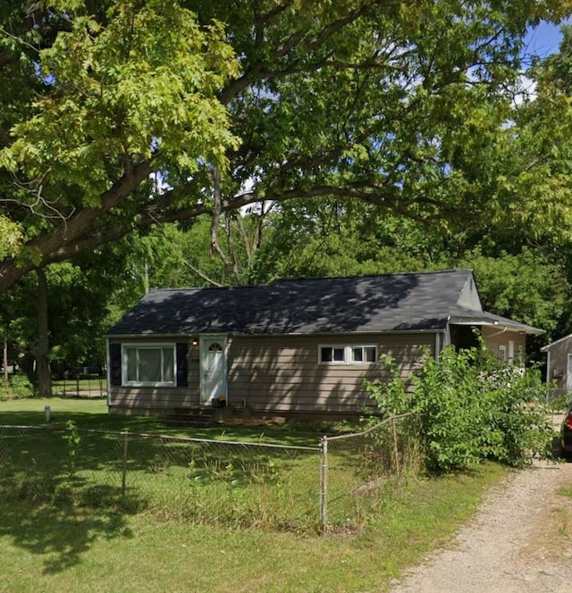 view of outbuilding with a lawn