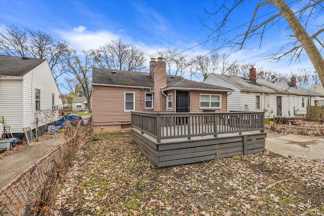 rear view of property with a wooden deck