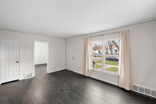 empty room featuring dark wood-type flooring