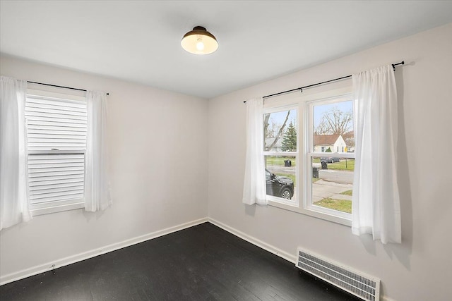 spare room with wood-type flooring