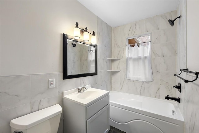 full bathroom featuring vanity, toilet, tile walls, and tiled shower / bath combo