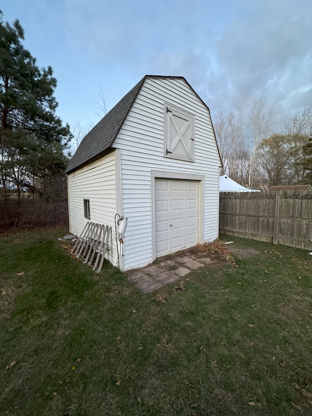 garage featuring a lawn