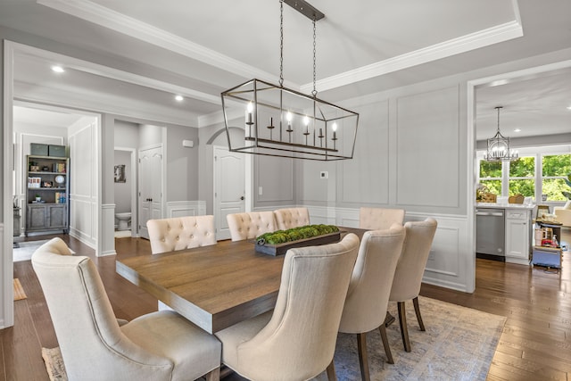 dining room with crown molding and dark wood-type flooring