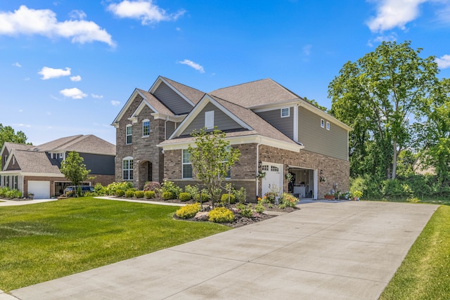 view of front of house featuring a garage and a front yard