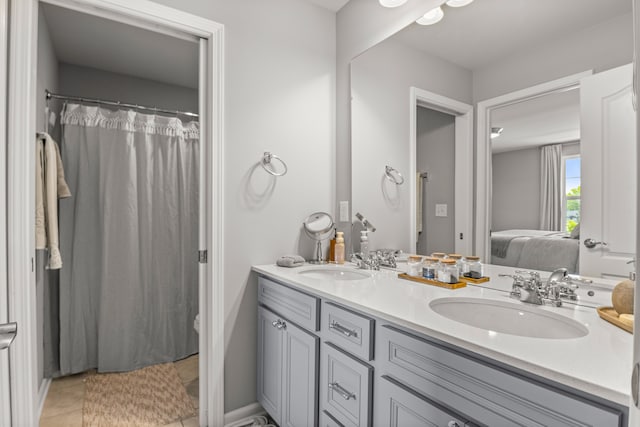 bathroom with tile patterned floors and vanity