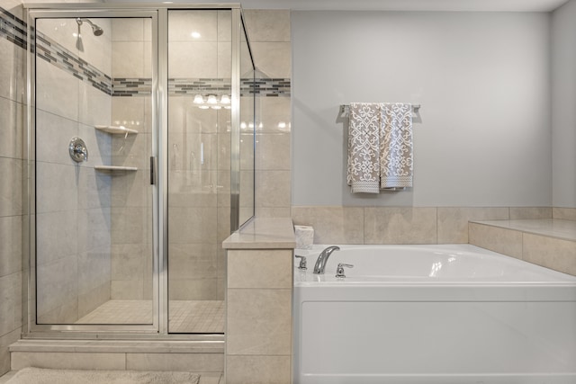 bathroom with separate shower and tub