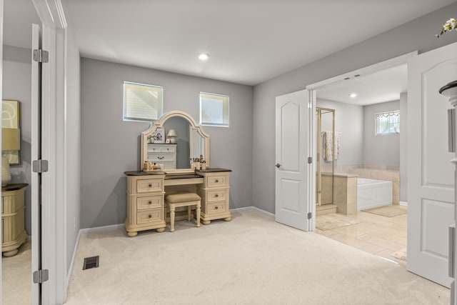 office area featuring light colored carpet and plenty of natural light