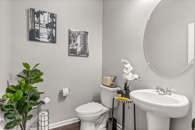 bathroom with toilet and sink