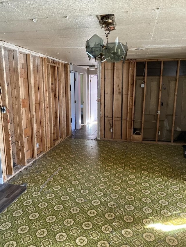 basement with a chandelier