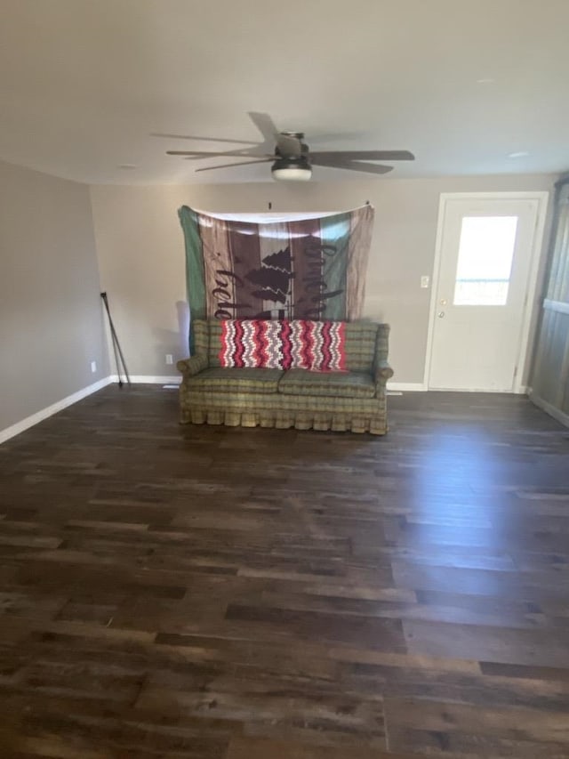 unfurnished room with dark wood-type flooring