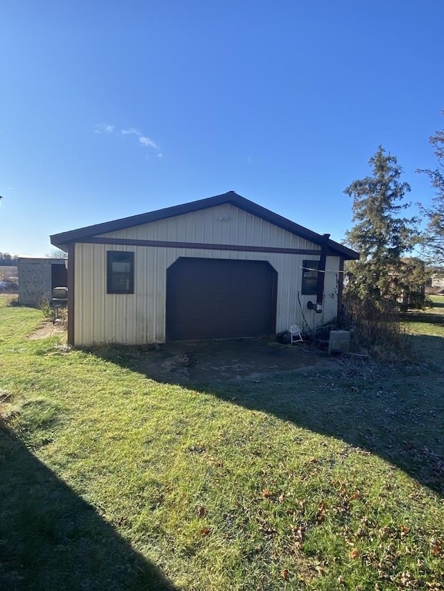 garage with a lawn