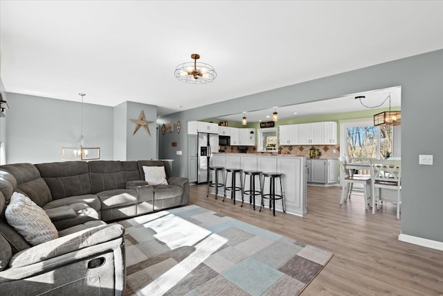 living room with light hardwood / wood-style floors