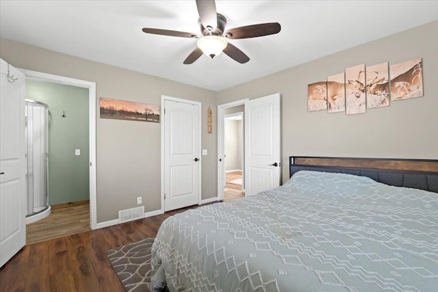 bedroom with dark hardwood / wood-style floors and ceiling fan