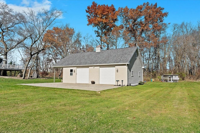 exterior space featuring a yard and a garage