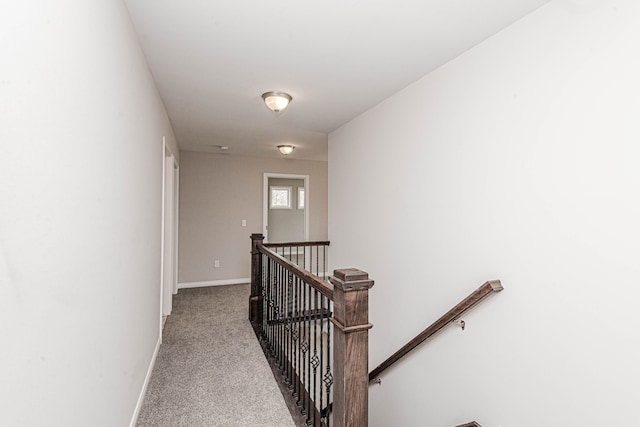 corridor with light colored carpet