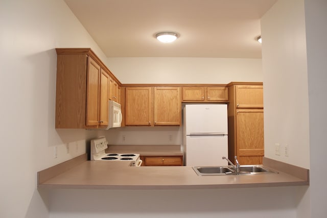 kitchen with sink and white appliances